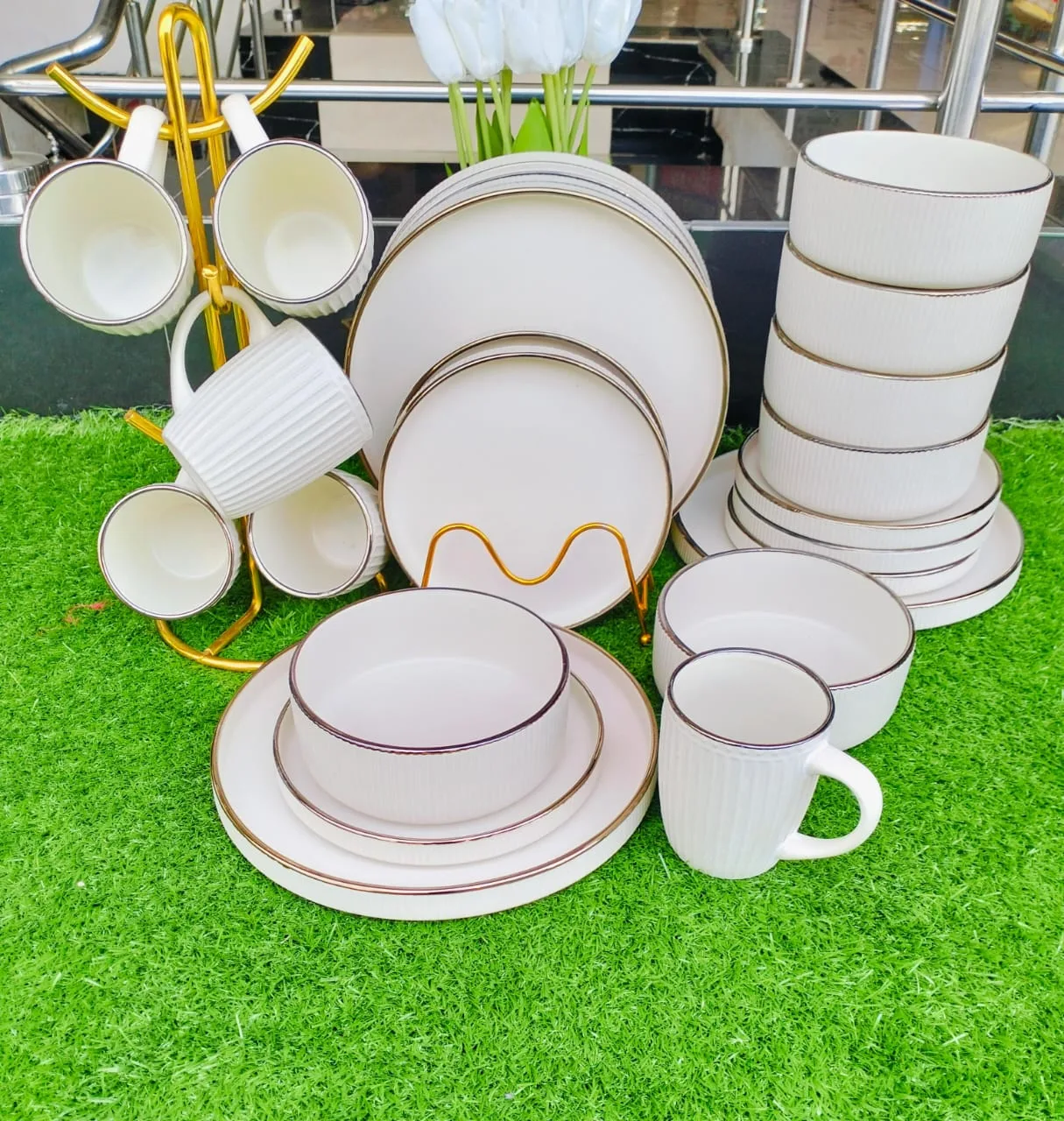 Cream ceramic dinner set with gold rim plates, bowls and mugs
